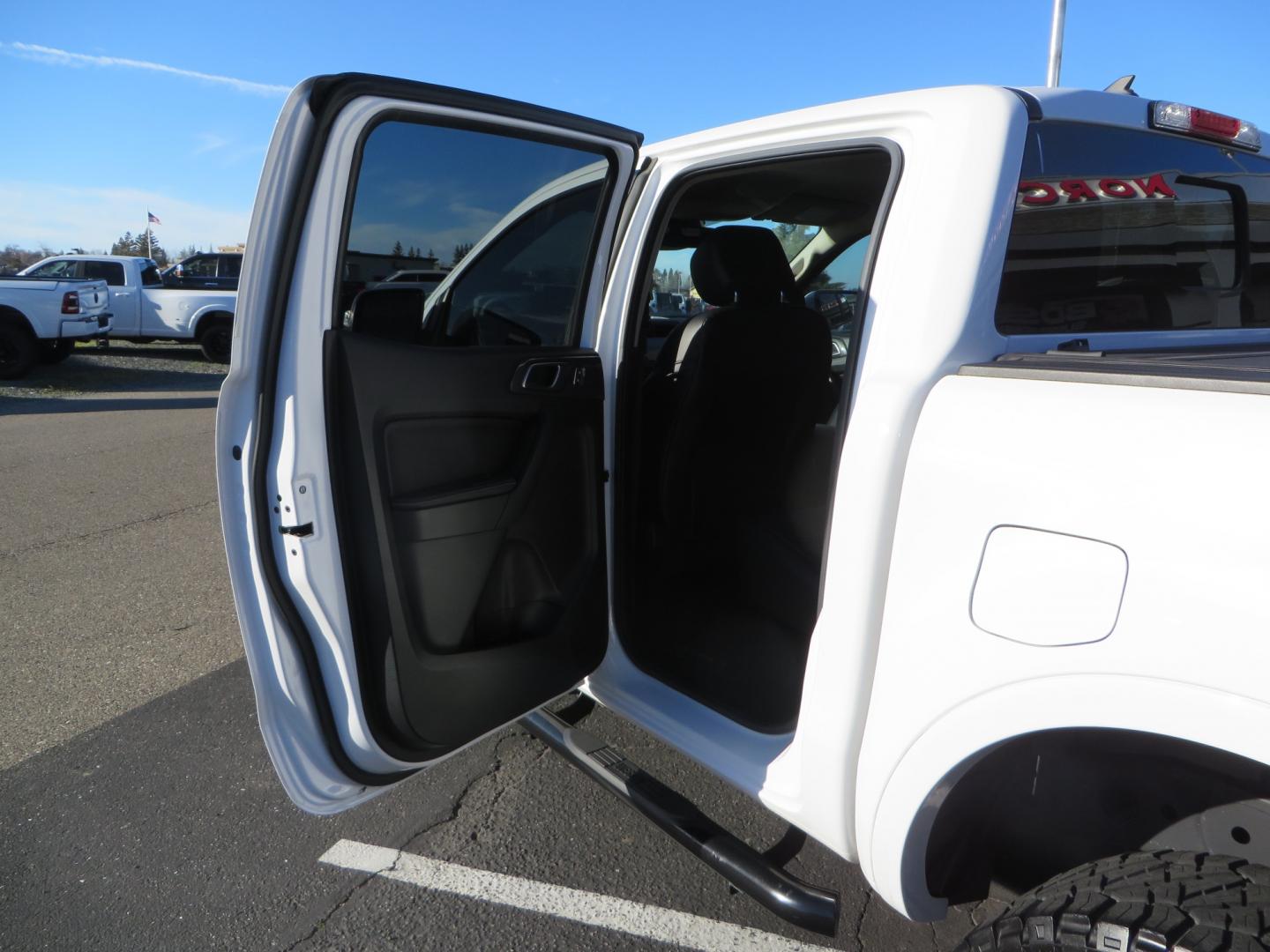 2019 White /Black Ford Ranger Lariat (1FTER4FHXKL) with an 2.3L engine, automatic transmission, located at 2630 Grass Valley Highway, Auburn, CA, 95603, (530) 508-5100, 38.937893, -121.095482 - Features a Fabtech suspension system, Fuel Offroad wheels, Nitto Ridge Grappler tires, Westin Running boards, and a Bakflip. - Photo#30